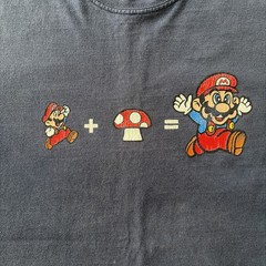 Nintendo Super Mario Mushroom Evolution T-Shirt – Men’s Large – Blue – USED
