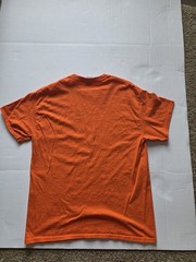 bright orange Surf Style tshirt features a navy blue graphic for ClearwaterBeach